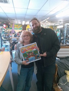 Price Jones, right,  poses with the first "Grown Folk" coloring book going to his very first Kickstarter backer. 