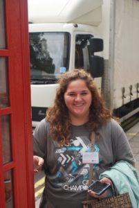 Kaitlyn Ellis, a Kiefer sophomore, checks out a traditional red phone booth outside London's Hard Rock Cafe.