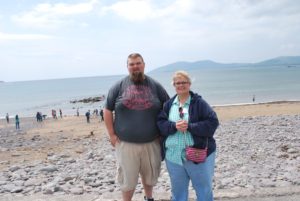 Sponsor Josh Quinnelly and group leader Lorrie Quinnelly, a Kiefer High School English teacher, pose at Waterville, Ireland, the costal city where Irish legend says Noah's granddaughter sailed and began the Irish race.