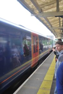 Kiefer High School junior Evan Webster waits to board a train to mid-town London.