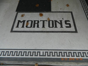 The tiled entrance to the old Morton's Department Store can still be found in front of Little Bit of Country.