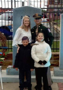 Officer Arnold and his family at the memorial outside Creek County Courthouse in Sapulpa.