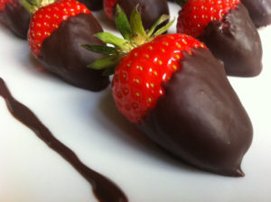 Get a FREE dozen chocolate-dipped strawberries with the purchase of a dozen roses from Vintage Rose Boutique and Flower Shop.