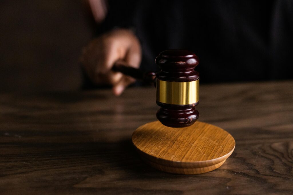 Brown wooden gavel on brown wooden table